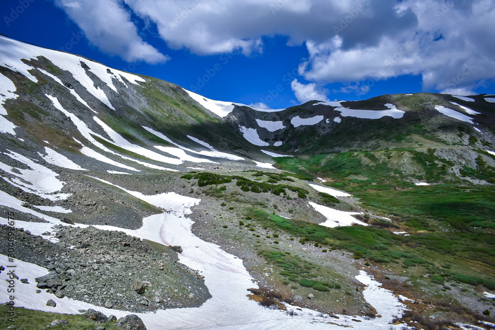 After record snowfalls in the Rockies this year, there were still patches of snow well into August.