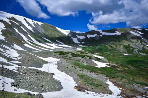 After record snowfalls in the Rockies this year, there were still patches of snow well into August.