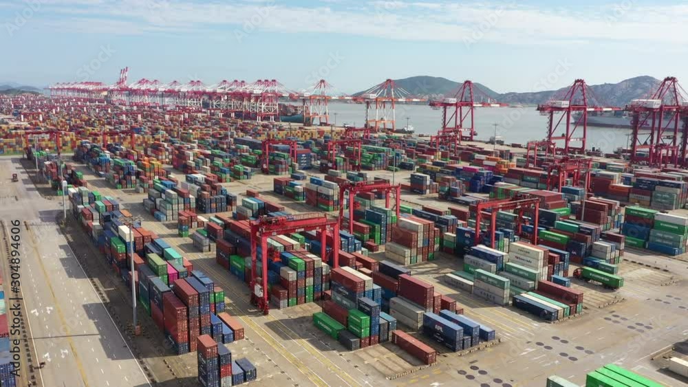 Low angle aerial view of container terminal in deep-water Port of Shanghai, overseas trade, shipping industry and globalization in China Asia