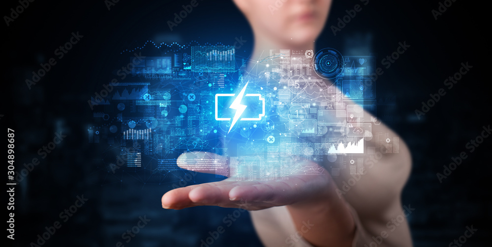 Elegant hand holding battery with full of energy Elegant hand holding battery with full of energy