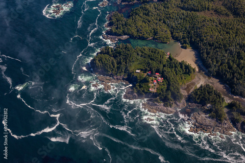 Aerial Landscape View of Beautiful Pacific Ocean Coast during a sunny summer morning. Taken at Pacific Rim National Park, South of Tofino and Ucluelet, Vancouver Island, British Columbia, Canada.