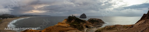 Cape Kiwanda, Pacific City, Oregon Coast, United States of America. Beautiful Panoramic Landscape View of a Sandy Shore on the Ocean during a cloudy summer sunset.