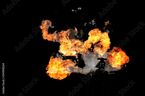Wallpaper Mural Fire from gas or oil leak from pipe.the oil pipeline leak and explose or Crude oil transport with pipe leak and explose.Gas pipeline leaks at the joints and valve isolated on black background. Torontodigital.ca