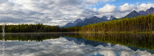 Beautiful Panoramic View of Herbert Lake surrounded by Canadian Rocky Mountain Landscape during a summer sunrise. Taken in Banff, Alberta, Canada.
