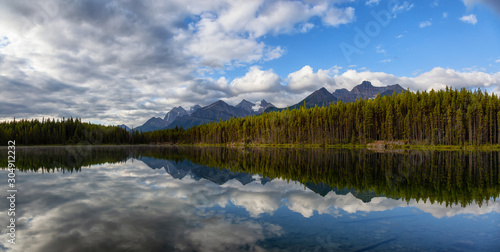 Beautiful Panoramic View of Herbert Lake surrounded by Canadian Rocky Mountain Landscape during a summer sunrise. Taken in Banff, Alberta, Canada.