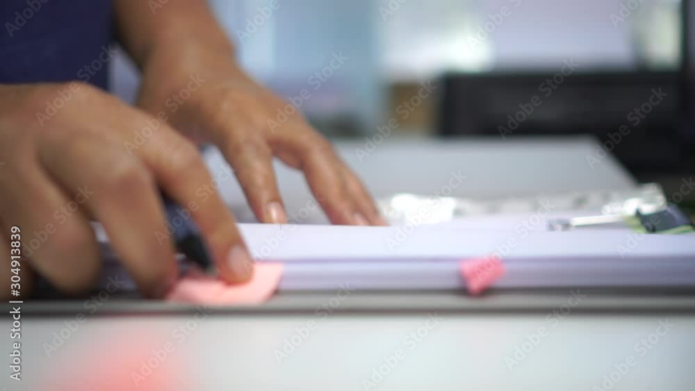 Stacks of paper files for searching information on work desk office by Businesswoman hands working, business report papers,piles of unfinished documents achieves on workload at workplace Stacks of paper files for searching information on work desk office by Businesswoman hands working, business report papers,piles of unfinished documents achieves on workload at workplace