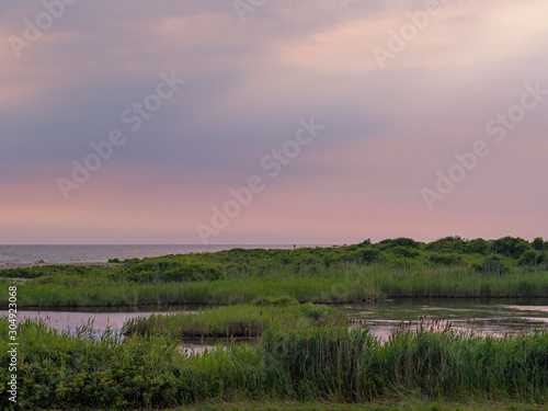 Point Judith Rhode Island peaceful landscape purple sky over salt pond photo