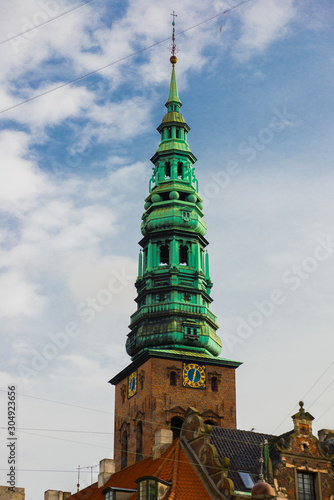 COPENHAGEN, DENMARK: View of the landmark green spire of the former St. Nicholas Church, now Nikolaj Contemporary Art Center in Copenhagen. Nikolaj Kunsthal photo