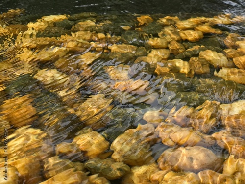 The various figures of the stones through the surface of the waving water.