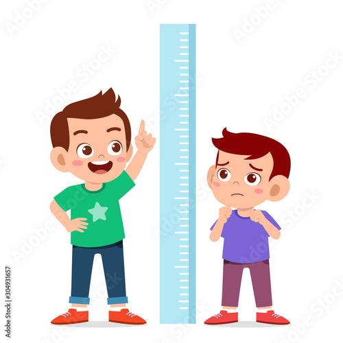 happy cute kid boy measure height together