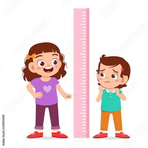 happy cute kid girl measure height together