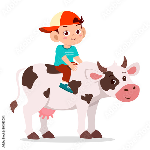 happy cute kid boy riding cute cow
