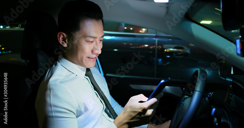 businessman use smartphone in car © ryanking999