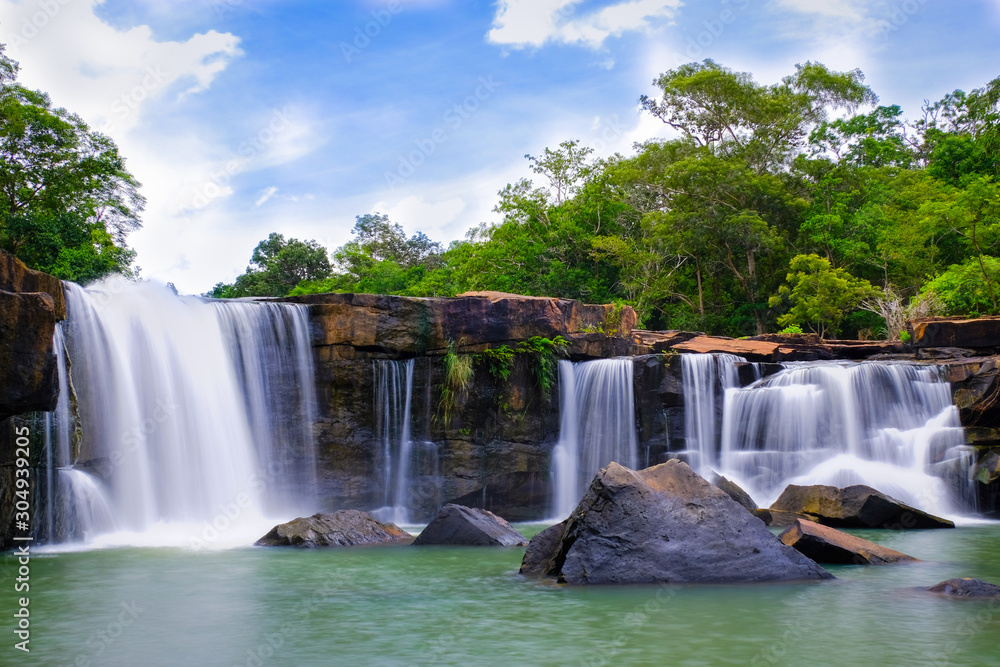 Naklejka premium Waterfall on the rocks,Tad Ton Waterfall is a major tourist attraction of Chaiyaphum Thailand is a beautiful waterfall. Located in Tad Tonkarn National Park ...