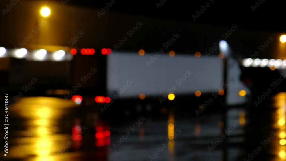 Semi truck traffic at night. Lorry delivering freight at warehouse Semi truck traffic at night. Lorry delivering freight at warehouse