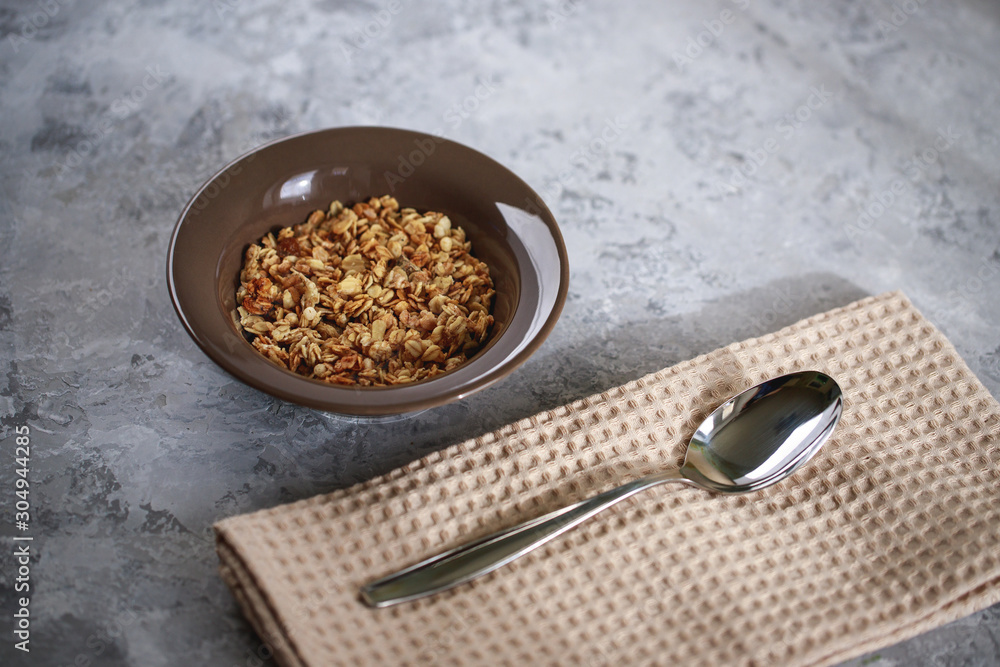 Healthy breakfast. Baked muesli in a grater. Homemade granola in a bowl. Space for text. Healthy breakfast. Baked muesli in a grater. Homemade granola in a bowl. Space for text.