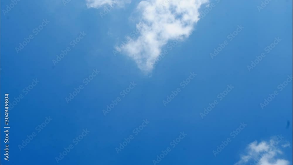 Time lapse clouds are floating from the bottom to the top on sunny blue sky, Cumulus with white fluffy cloud formations at tropical zone , Thailand Time lapse clouds are floating from the bottom to the top on sunny blue sky, Cumulus with white fluffy cloud formations at tropical zone , Thailand