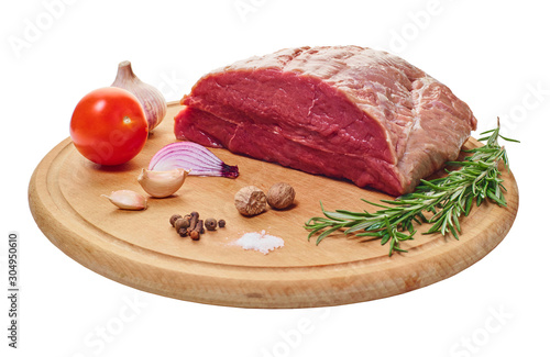 raw meat with vegetables and seasonings on the board