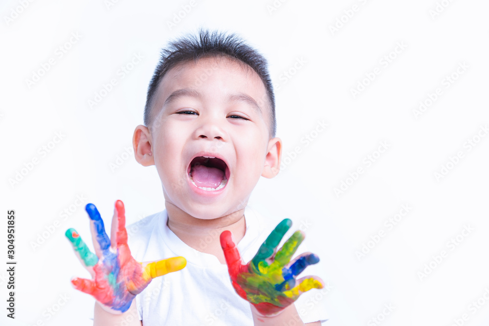 Happy asian little baby boy show hand he have water color or finger paint on hands Happy asian little baby boy show hand he have water color or finger paint on hands