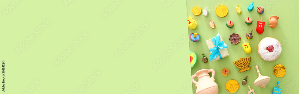 religion image of jewish holiday Hanukkah background with spinning top and doughnut religion image of jewish holiday Hanukkah background with spinning top and doughnut