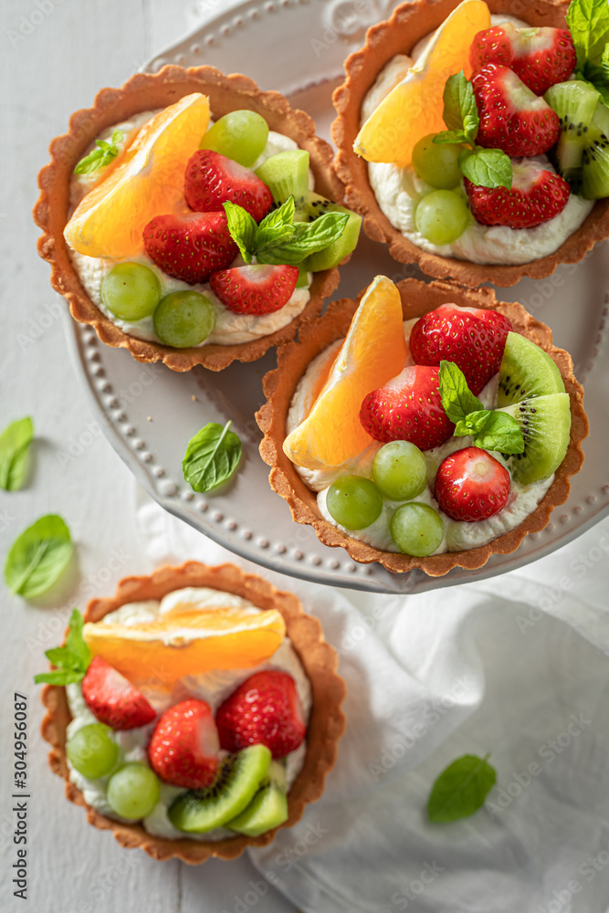 Top view of mini tart with fruits and cream Top view of mini tart with fruits and cream