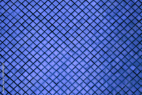 Abstract - Sculpture of blue wall texture square patterns of pagoda at Wat Phra Si Rattana Satsadaram or Royal Grand Palace buddha temple Bangkok Thailand.