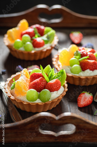 Fresh mini tart made of whipped cream and fresh fruits