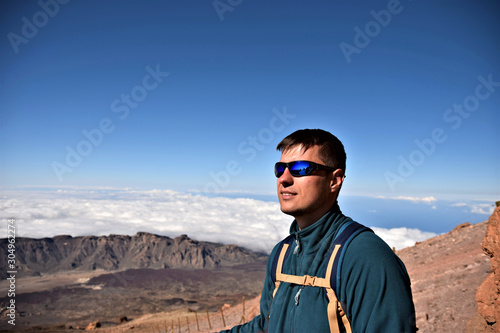 Young tourist hiking in the mountains, Teide, Tenerife