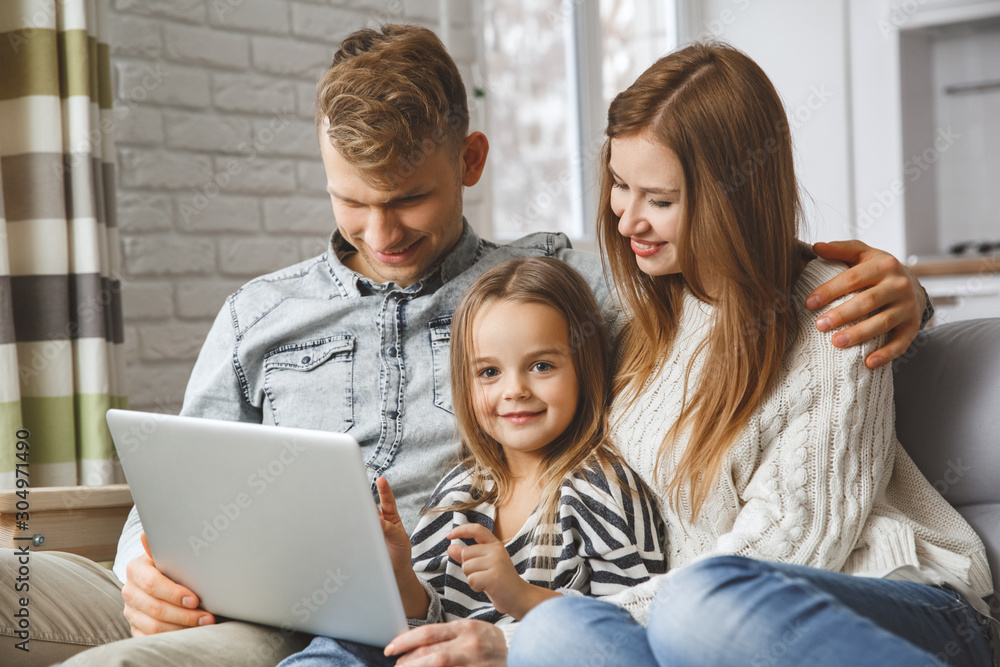 Family at home together leisure love concept browsing laptop Family at home together leisure love concept browsing laptop