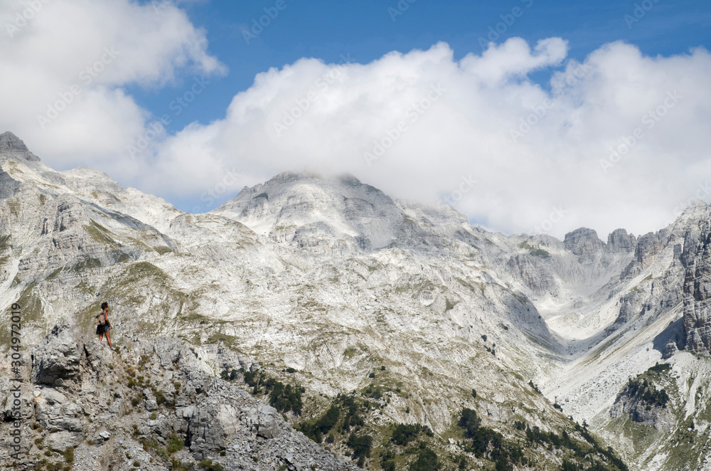 View of summit Jezerca in Albanian Alps from Valbona Pass during hike from Theth to Valbona View of summit Jezerca in Albanian Alps from Valbona Pass during hike from Theth to Valbona