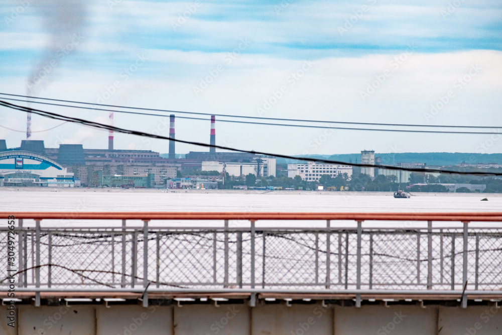 Khabarovsk, Russia - Aug 21, 2019: Flood on the Amur river near the city of Khabarovsk. The level of the Amur river at around 601 centimeters. Khabarovsk, Russia - Aug 21, 2019: Flood on the Amur river near the city of Khabarovsk. The level of the Amur river at around 601 centimeters.