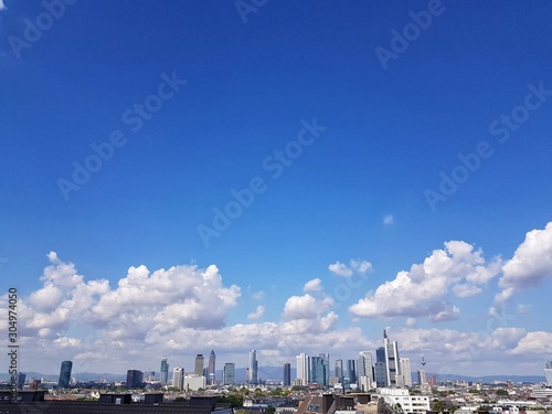 view of city with blue sky and clouds