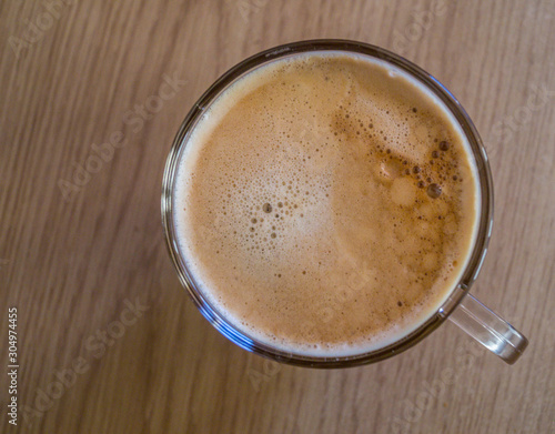 Coffee Time- A glass mug of coffee top view