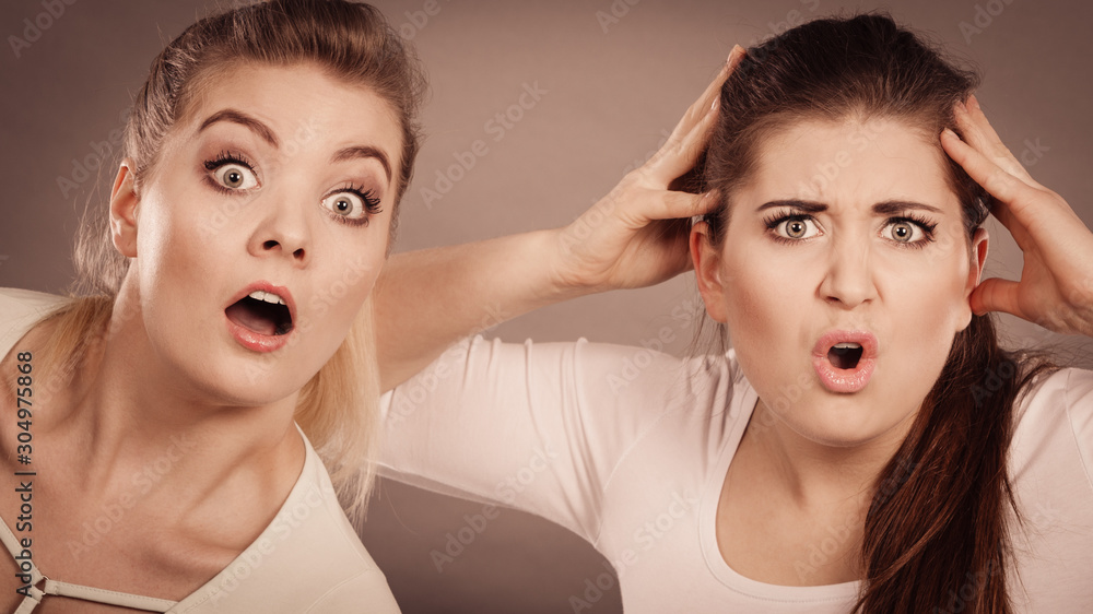 Two shocked and amazed women