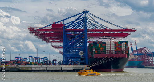 Photography Container handling gantry cranes, container terminal and  ferryboat  by Burchard