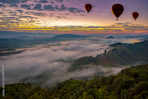 The sea of fog at sunrise Can see the Laos side of the Mekong River In Nong Khai province, Thailand photo