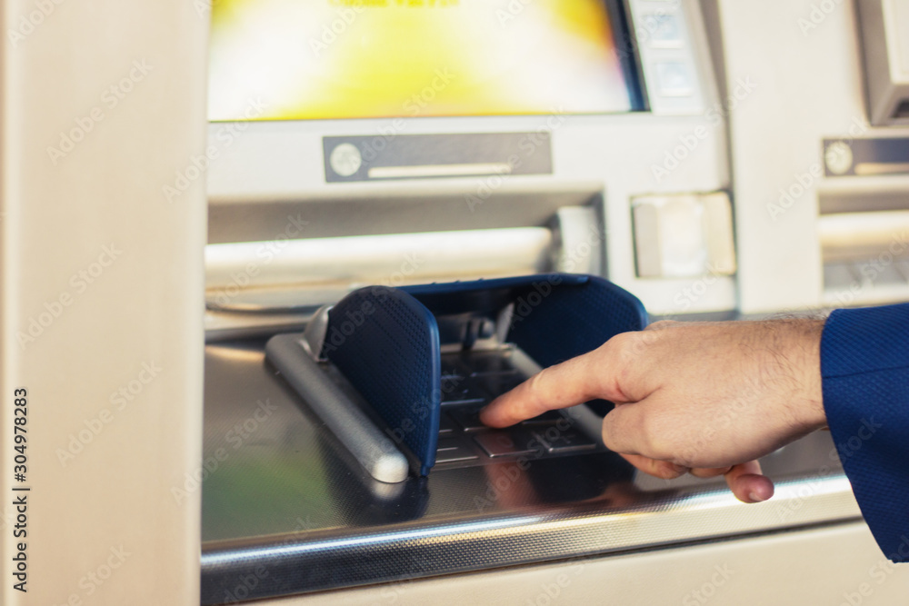Typing pin at ATM. Typing pin at ATM.