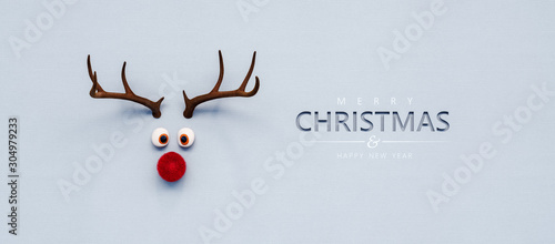 Fotografiet Reindeer toy with red nose Christmas background concept 3D Rendering