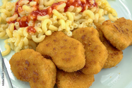 plate of chicken nuggets and pasta