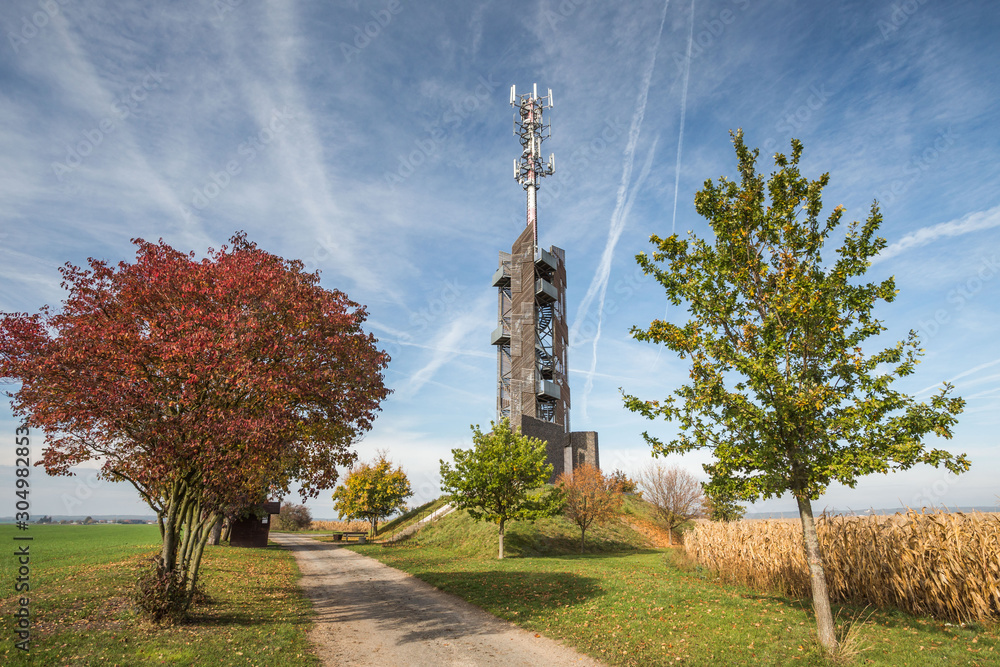 Romanka Lookout Tower is located near village Hruby Jesenik in the district Nymburk in the Central Region. Czech republic. Is is also antenna transmitter. Nice autumn colorful scene with blue sky.