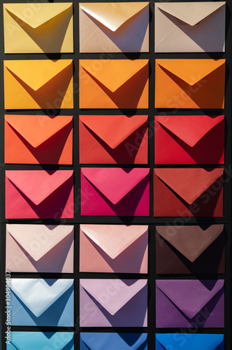 Gradient of multi color envelope on a store background.