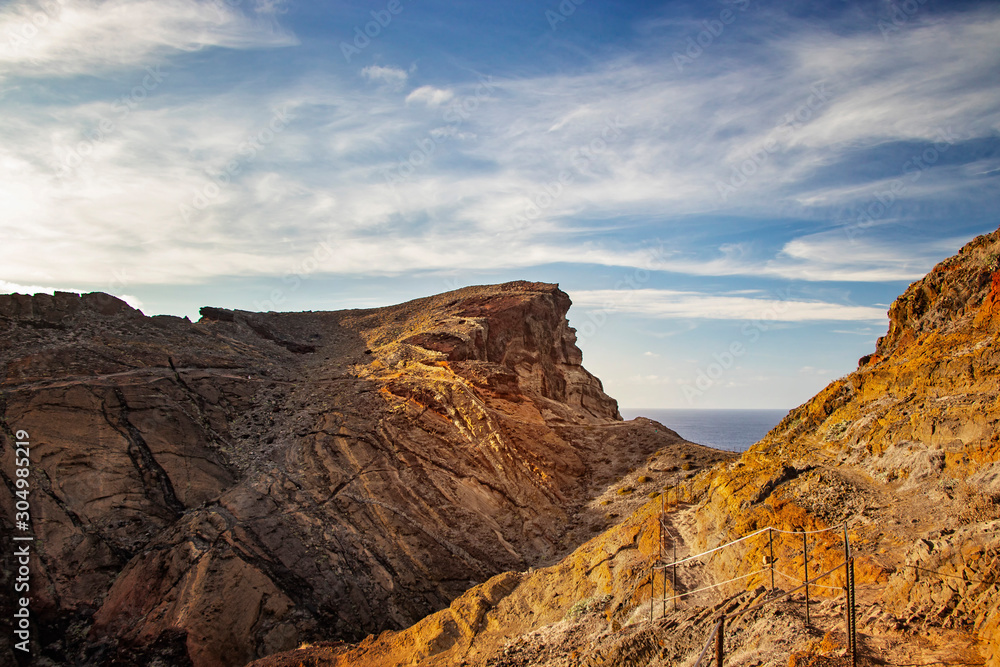 Obraz premium Walking hike tour in Maderia island, Ponta de sao Lourenco. It is nature background of a wonderful view of the sea cliffs, Portugal. It is a natural background.