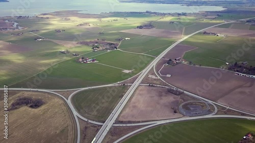 Top down aerial view of highway intersection with moving traffic cars.  photo