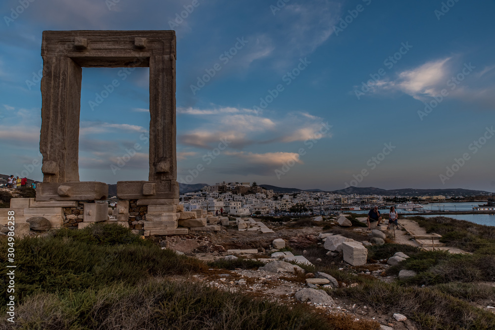 Portara - ruins of ancient temple of Delian Apollo on Naxos island at sunset, Cyclades archipelago, Greece.