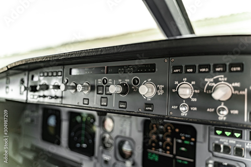 Close up of functioning empty cockpit of an airplane