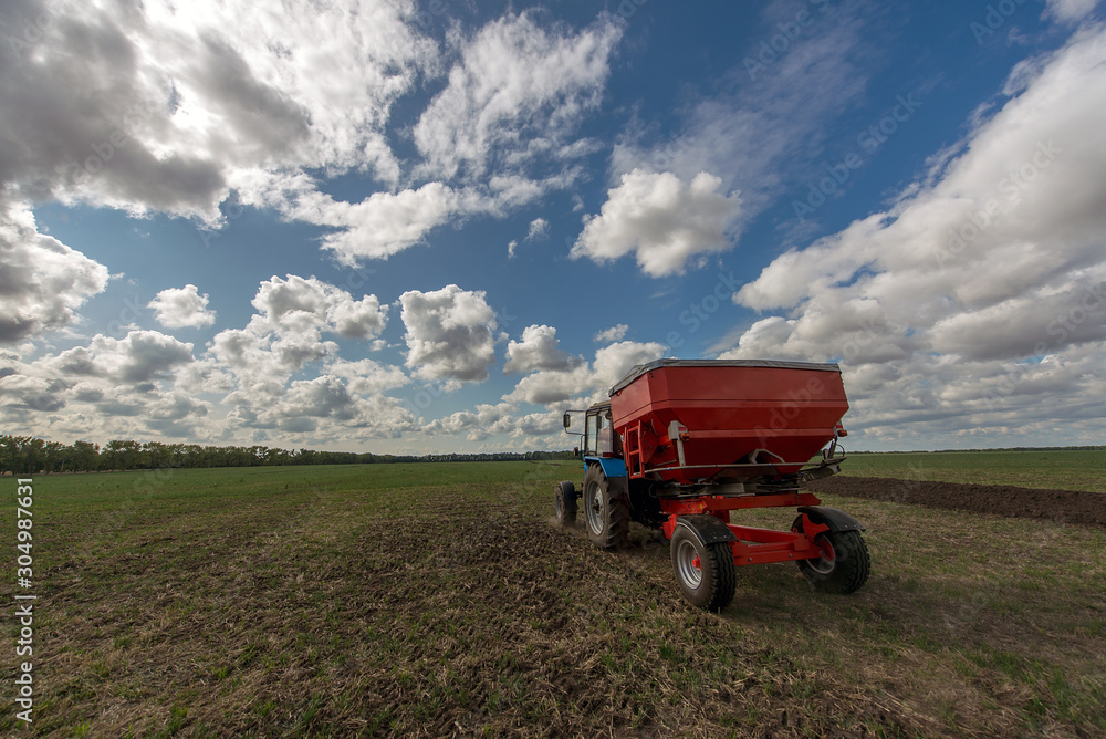 Fototapeta premium technology of preparing soil for sowing, plow plowing the land