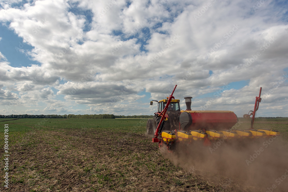 Fototapeta premium Ukraine, tractor seed drill hybrids seeds