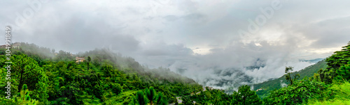 The clouds and the mountain range while driving to Binsar, near Almora, Uttarakhand- lush green vegetation all around, rainy season, monsoon India © Sondipon