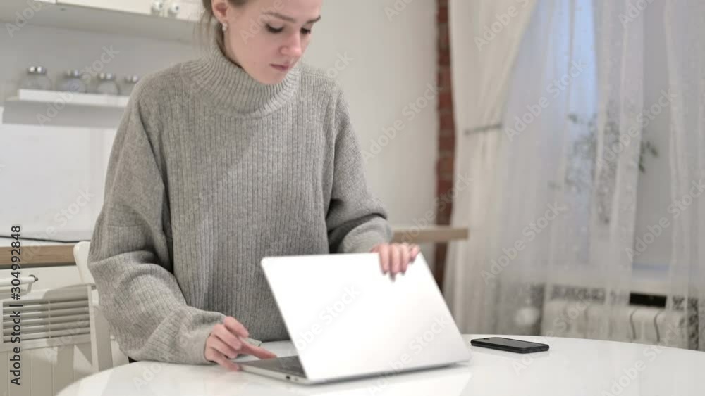Young Woman Standing up and Leaving Room Young Woman Standing up and Leaving Room