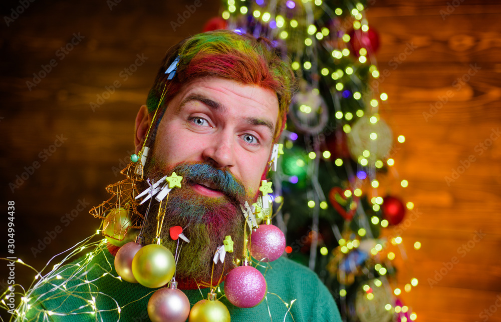 Happy Santa man with decorated beard. Christmas beard decorations. Decorated beard. Merry Christmas and happy new year. Smiling bearded man with decorated beard. New year party. Christmas decorations. Happy Santa man with decorated beard. Christmas beard decorations. Decorated beard. Merry Christmas and happy new year. Smiling bearded man with decorated beard. New year party. Christmas decorations.